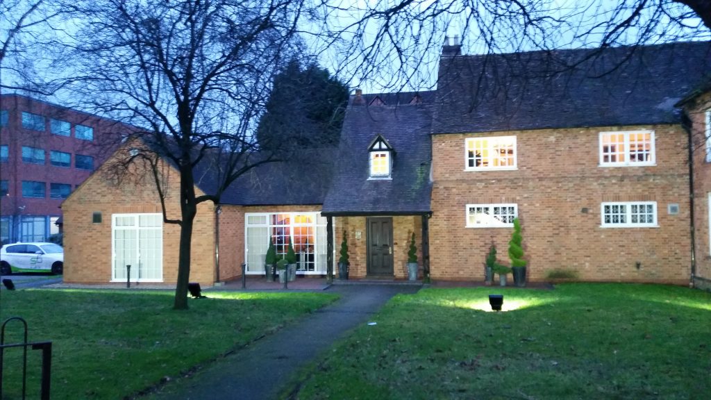 Completed LED exterior lighting installation illuminating a historic building in Solihull after dark.