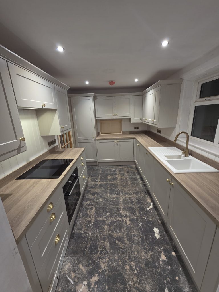 Kitchen electrical rewire installation with LED spotlights, heat detector and new wiring.